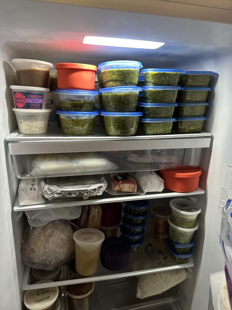 The big freezer full of containers. Many are pesto. 
